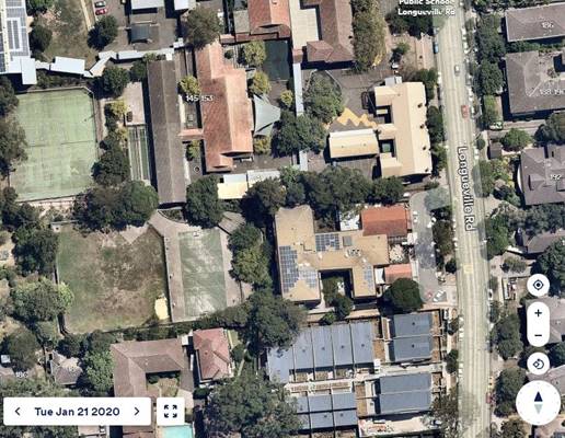 Aerial view of a neighborhood
Description automatically generated