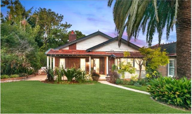 A house with a lawn and trees
AI-generated content may be incorrect.