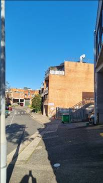 A street with a building

AI-generated content may be incorrect.