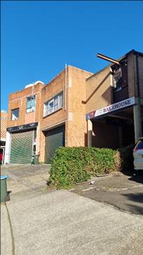 A building with a sign on the front

AI-generated content may be incorrect.
