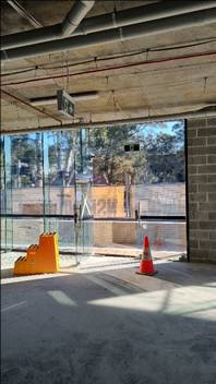 A glass wall with a traffic cone

AI-generated content may be incorrect.