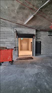 A brick building with a door open

AI-generated content may be incorrect.