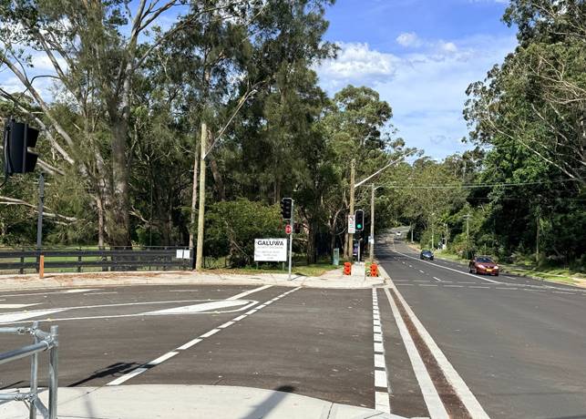 A road with trees and a street light

AI-generated content may be incorrect.