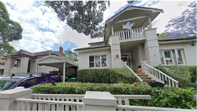 A house with a white fence and a white fence

AI-generated content may be incorrect.