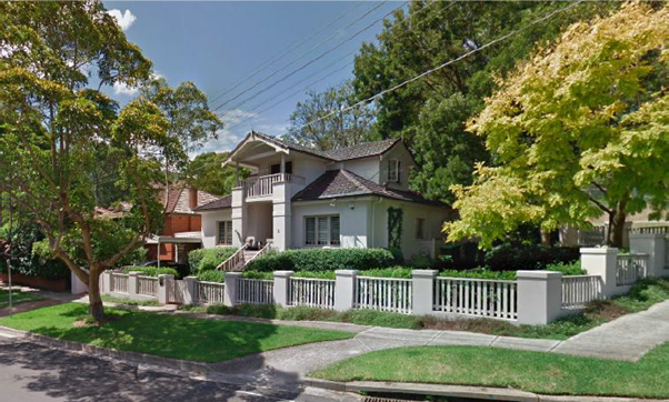 A house with a fence and trees

AI-generated content may be incorrect.