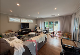 A living room with a couch and a television

AI-generated content may be incorrect.