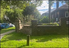 A brick wall in a yard

AI-generated content may be incorrect.