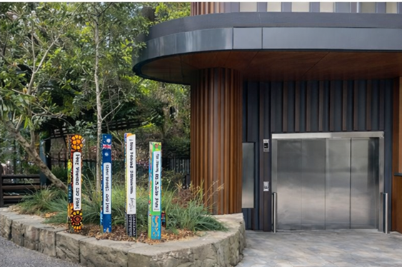 A building with a group of colorful poles
AI-generated content may be incorrect.